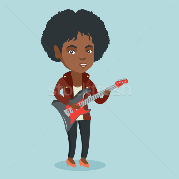 Young african woman playing the electric guitar. Stock photo © RAStudio