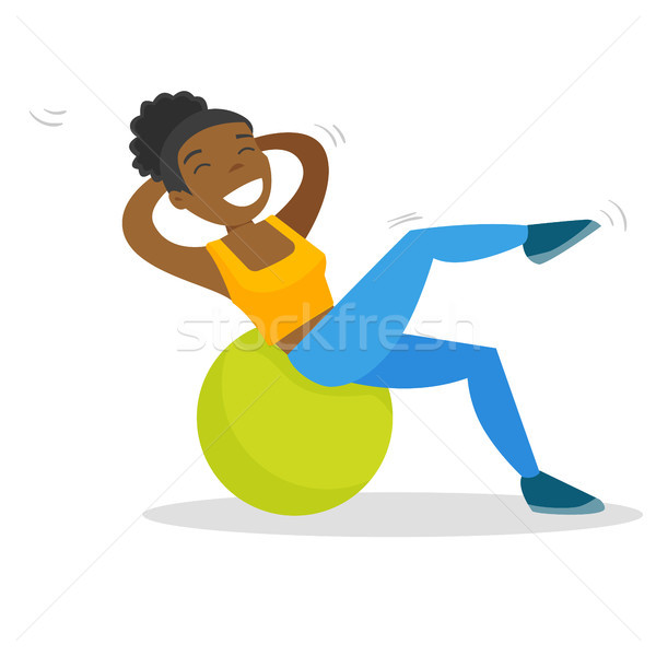 African-american woman exercising with fitball. Stock photo © RAStudio