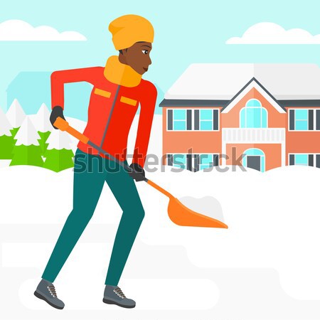 Woman shoveling and removing snow. Stock photo © RAStudio