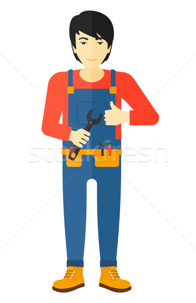 Cheerful repairman with spanner. Stock photo © RAStudio