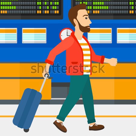 Man walking with suitcase. Stock photo © RAStudio