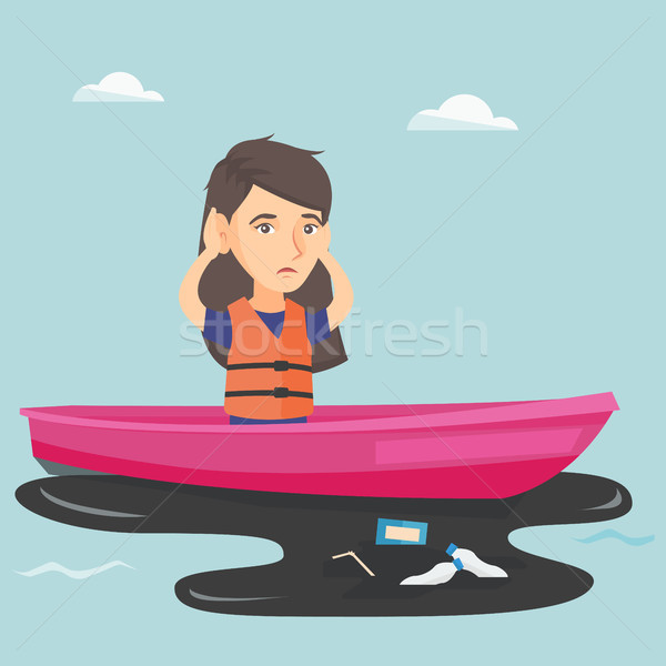 Young woman floating on a boat in polluted water. Stock photo © RAStudio