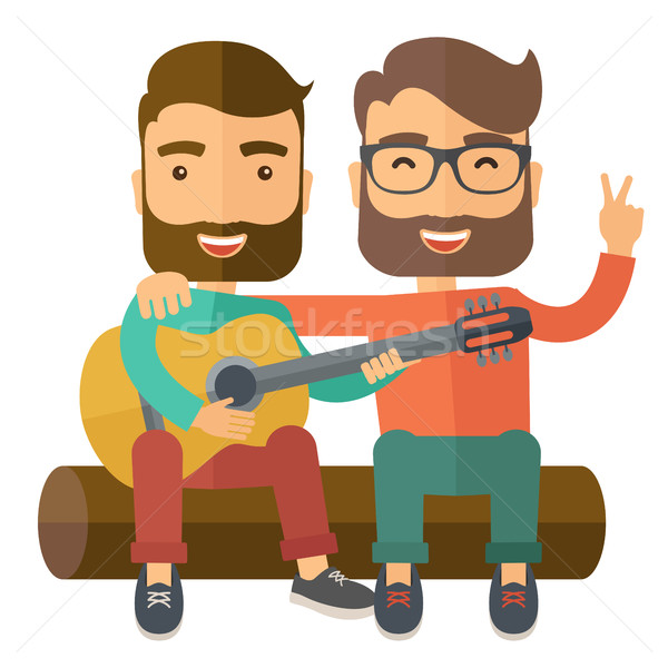Stock photo: Two men playing a guitar.