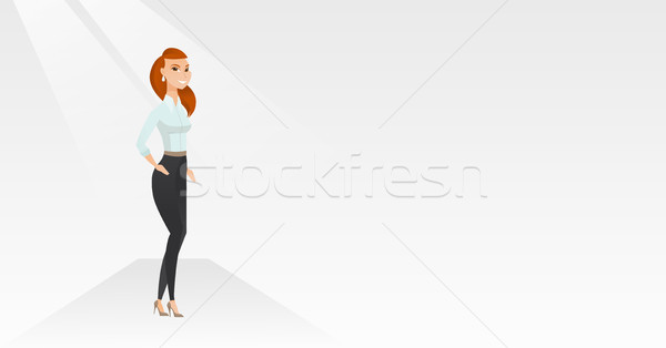 Stock photo: Woman posing on catwalk during fashion show.
