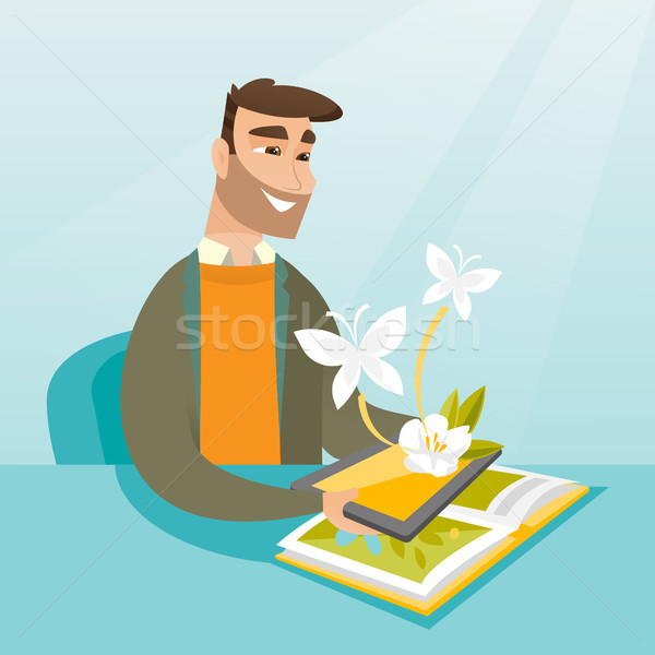 Young man holding tablet computer above the book. Stock photo © RAStudio
