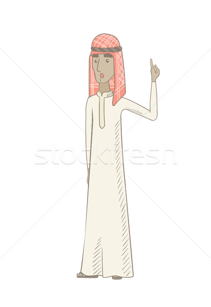 Muslim man with open mouth pointing finger up. Stock photo © RAStudio