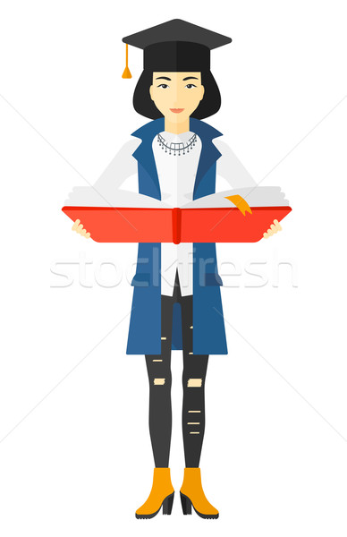Woman in graduation cap holding book. Stock photo © RAStudio