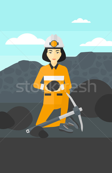 Miner holding coal in hands. Stock photo © RAStudio