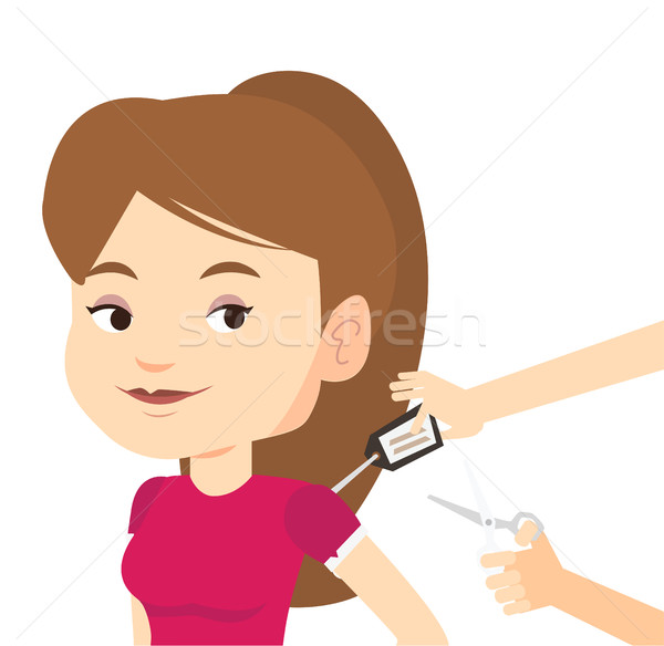 Woman cutting price tag off new t-shirt. Stock photo © RAStudio