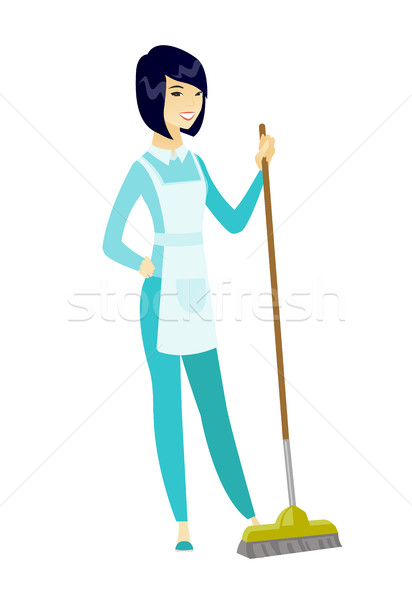 Young housemaid sweeping floor with a broom. Stock photo © RAStudio