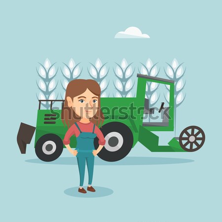 Farmer standing with combine on background. Stock photo © RAStudio