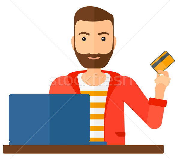 Człowiek online posiedzenia laptop karty kredytowej Zdjęcia stock © RAStudio