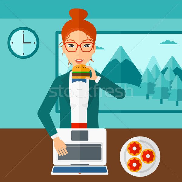 Woman eating hamburger.  Stock photo © RAStudio