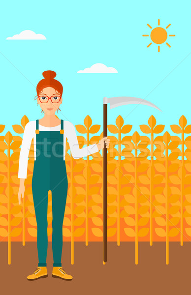 Farmer on the field with scythe. Stock photo © RAStudio