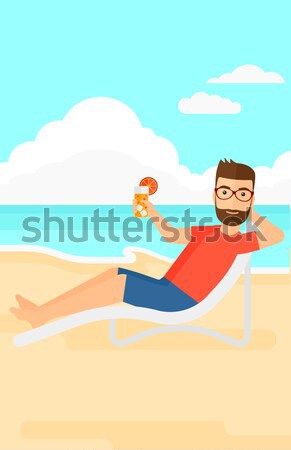 Man sitting in chaise longue. Stock photo © RAStudio