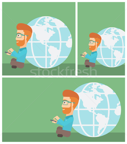 Businessman sitting near Earth globe. Stock photo © RAStudio