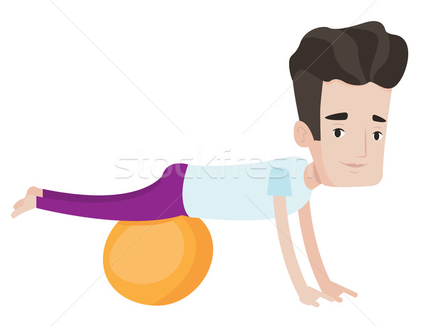 Young man exercising with fitball. Stock photo © RAStudio