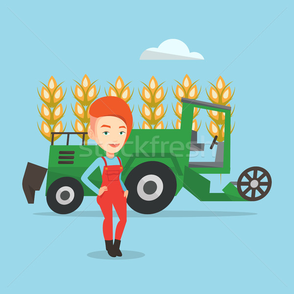 Farmer standing with combine on background. Stock photo © RAStudio