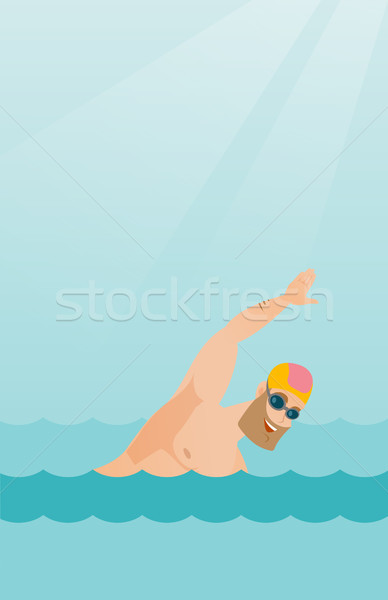 Young caucasian sportsman swimming. Stock photo © RAStudio