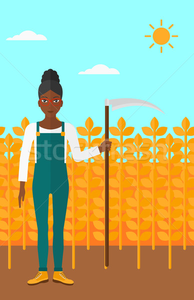 Farmer on the field with scythe. Stock photo © RAStudio