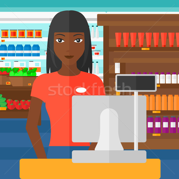 Saleslady standing at checkout. Stock photo © RAStudio