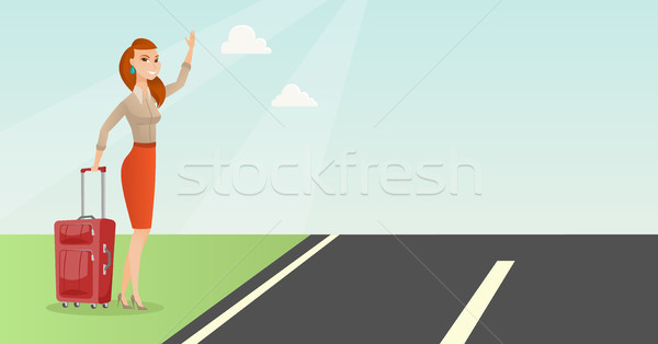 Young caucasian woman with suitcase hitchhiking. Stock photo © RAStudio