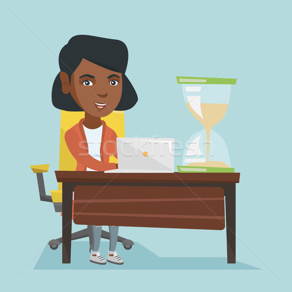 Young african business woman working in office. Stock photo © RAStudio