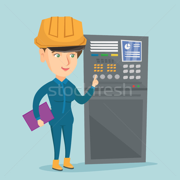 Stock photo: Industrial engineer working on control panel.