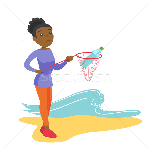 Stock photo: Woman catching plastic bottle from sea water.