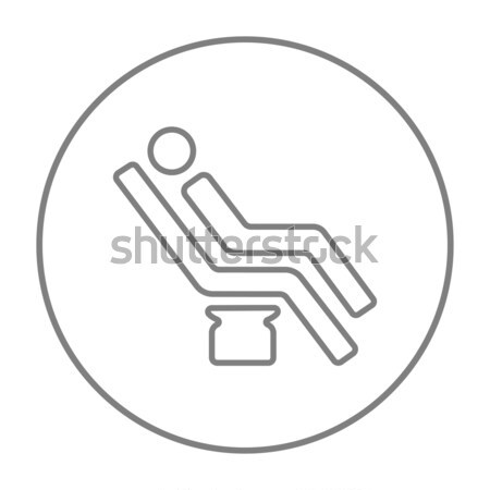 Man sitting on dental chair line icon. Stock photo © RAStudio