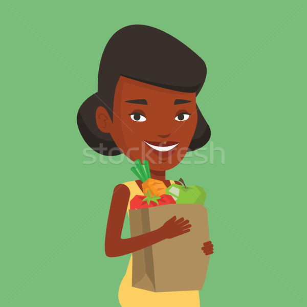 Boldog nő tart élelmiszer bevásárlószatyor afrikai Stock fotó © RAStudio