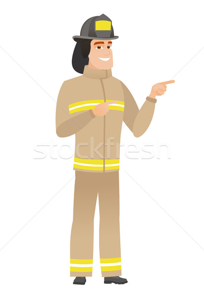 Stockfoto: Jonge · kaukasisch · brandweerman · wijzend · kant · uniform