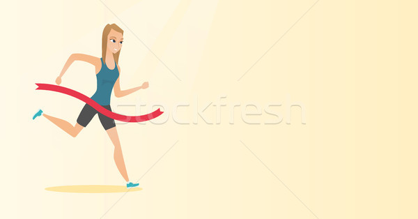 Young caucasian sportswoman crossing finish line. Stock photo © RAStudio