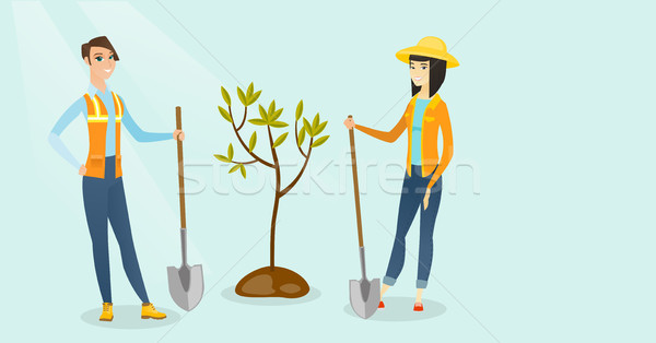 Caucasian white and asian women plant a tree. Stock photo © RAStudio