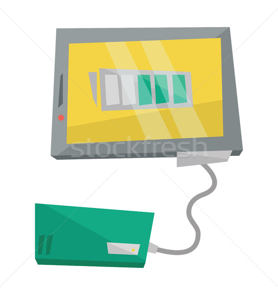 Stock photo: Charging digital tablet from solar battery.