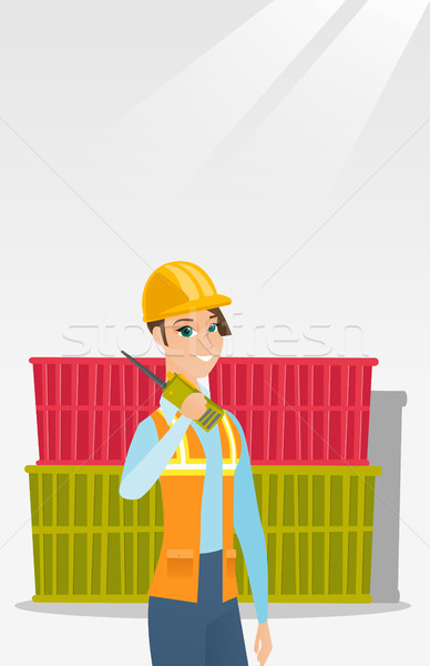 Port worker talking on wireless radio. Stock photo © RAStudio