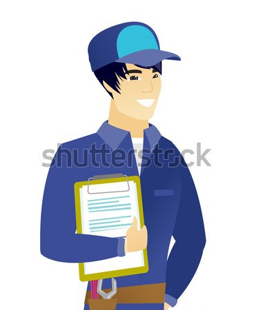 Businessman holding clipboard with documents. Stock photo © RAStudio