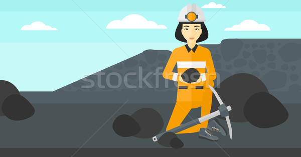 Miner holding coal in hands. Stock photo © RAStudio