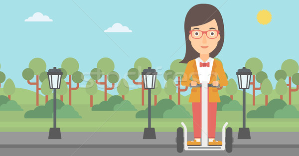 Woman riding on electric scooter. Stock photo © RAStudio