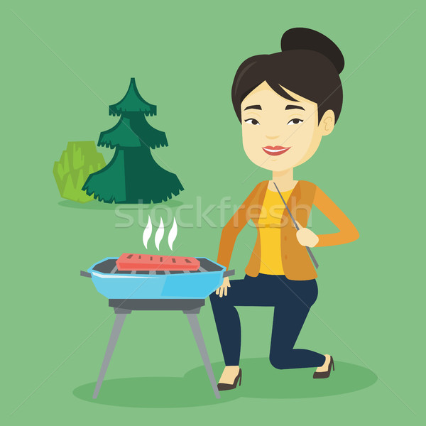 Woman cooking steak on barbecue grill. Stock photo © RAStudio