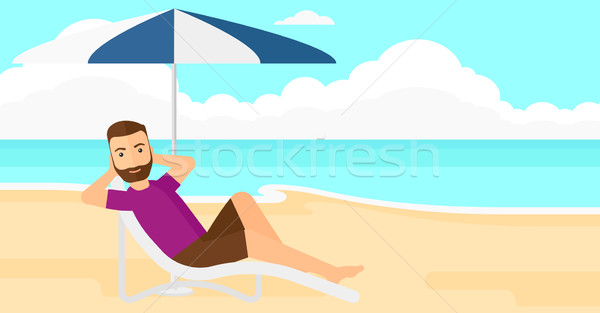 Man sitting in chaise longue. Stock photo © RAStudio
