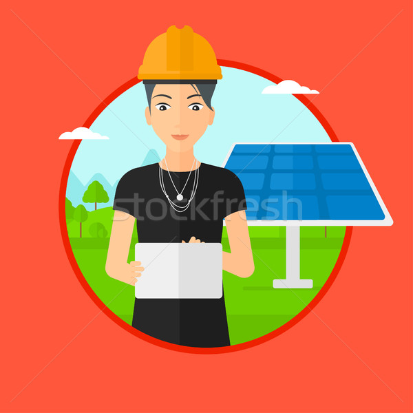 Female worker of solar power plant. Stock photo © RAStudio