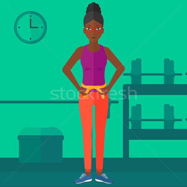 Woman measuring waist. Stock photo © RAStudio