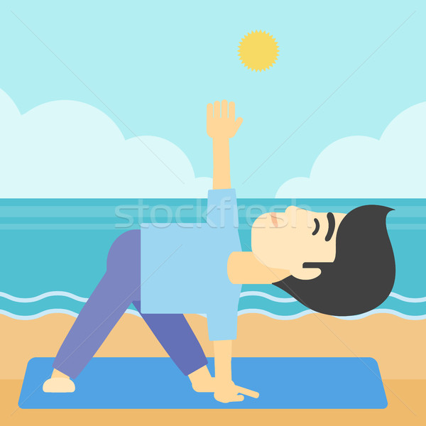 Man practicing yoga triangle pose on the beach. Stock photo © RAStudio