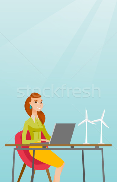 Woman working with model of wind turbines. Stock photo © RAStudio