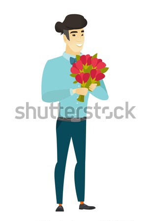Asian groom holding a bouquet of flowers Stock photo © RAStudio