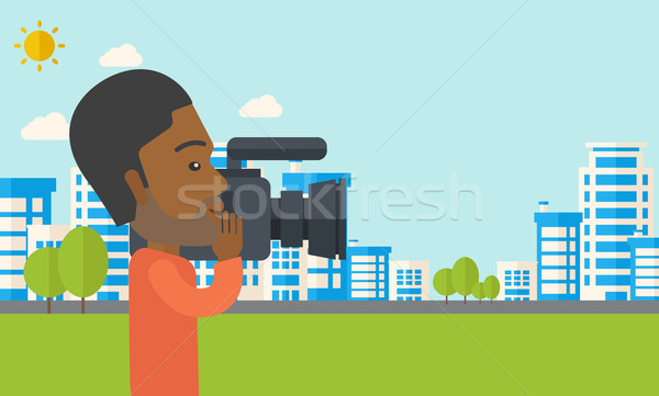 Caméraman caméra vidéo vidéo bâtiments Photo stock © RAStudio