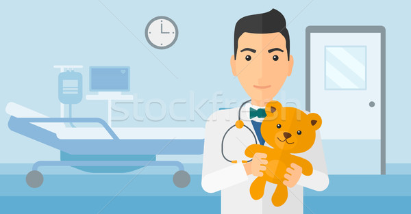 Pediatrician holding teddy bear. Stock photo © RAStudio