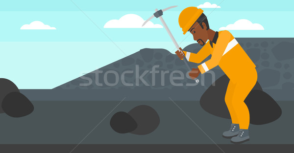 Miner working with pick. Stock photo © RAStudio