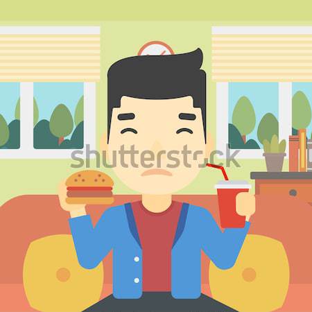 Uomo mangiare hamburger barba seduta Foto d'archivio © RAStudio